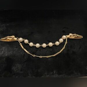 Vintage gold tone and foe pearl sweater clip
